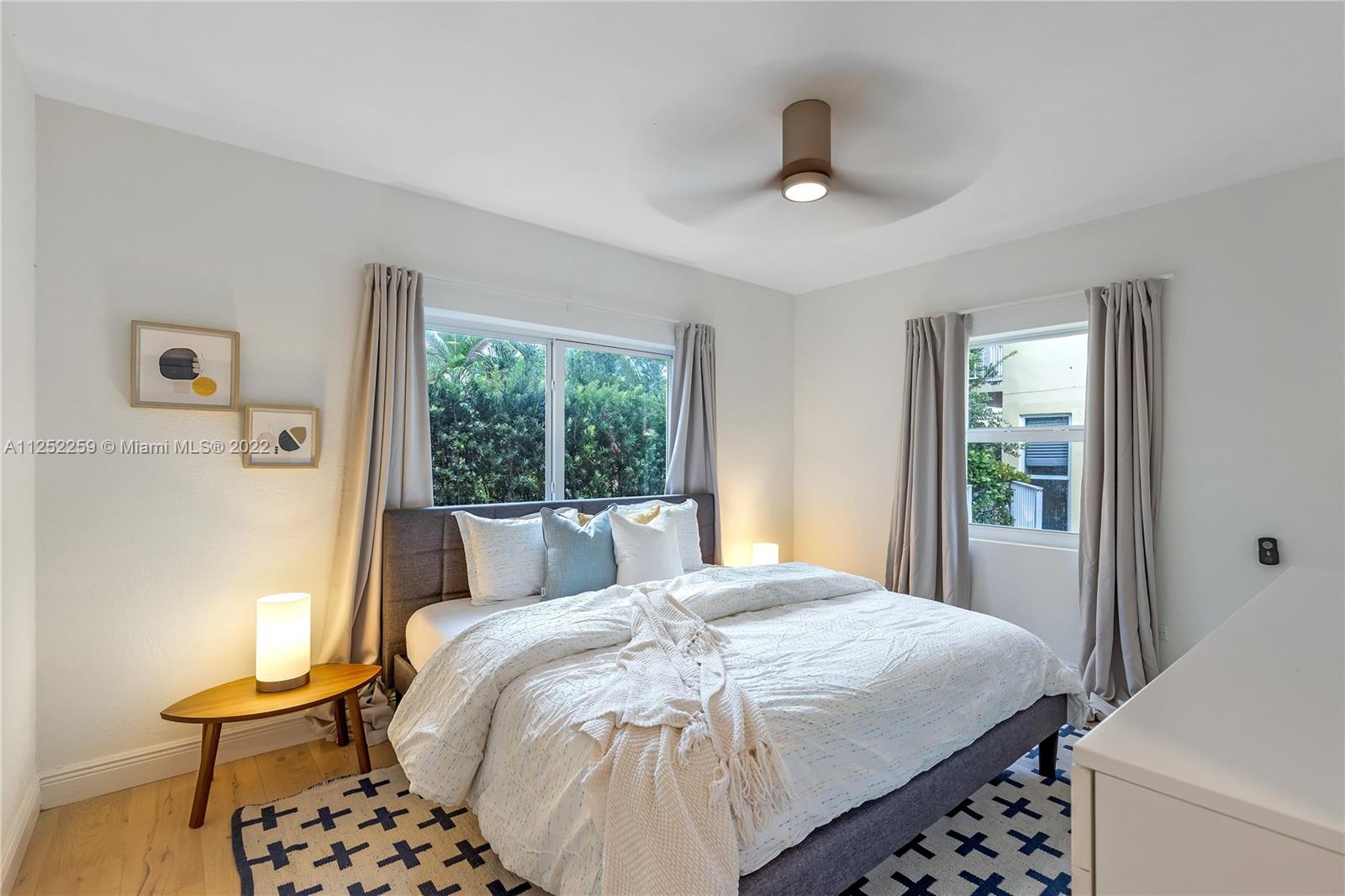 1757 Daytonia Road Miami Beach, FL 33141 - Photo 20 of 30 a bedroom with a bed and a window