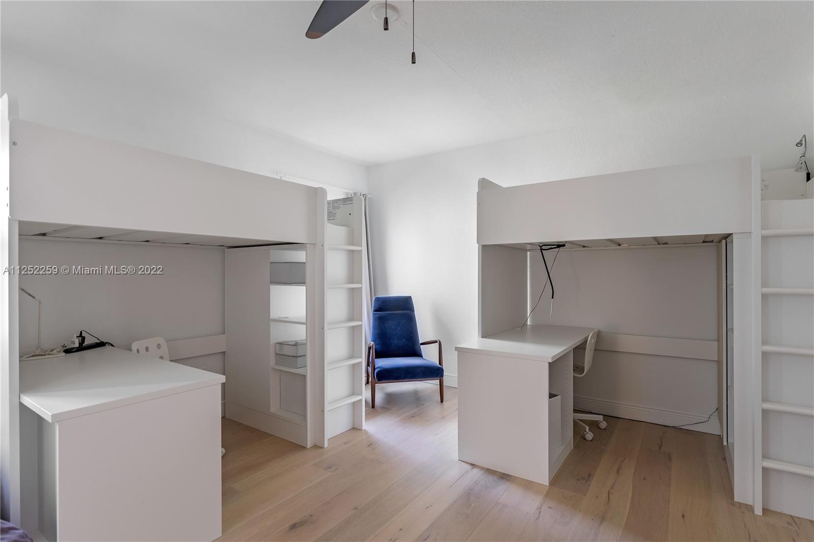 1757 Daytonia Road Miami Beach, FL 33141 - Photo 23 of 30 a room with a walk in closet and wooden floor