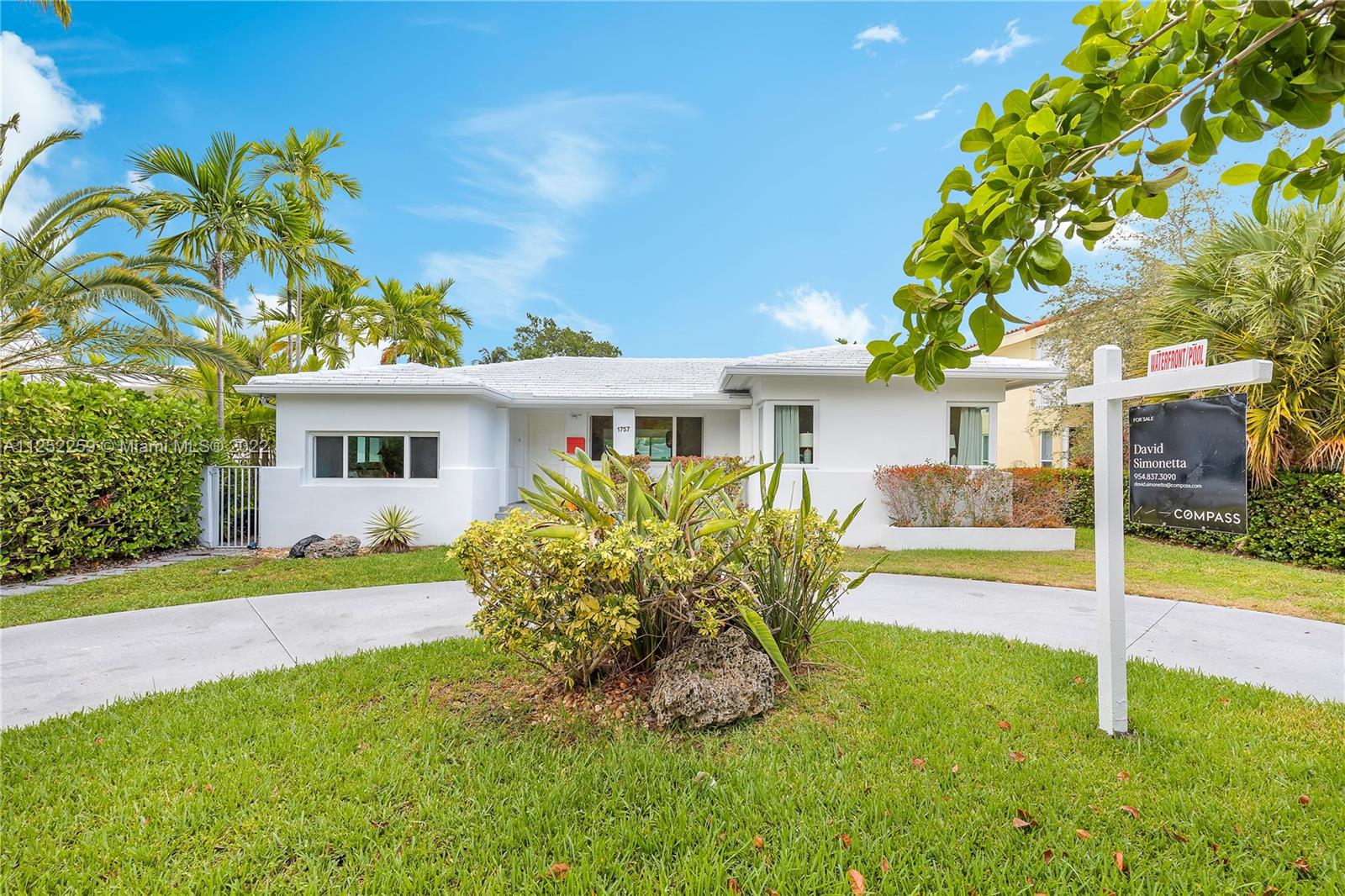 1757 Daytonia Road Miami Beach, FL 33141 - Photo 6 of 30 a front view of house with yard and green space