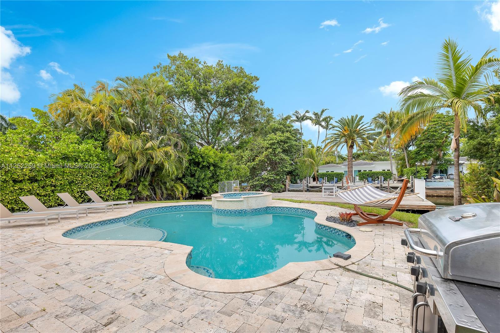 1757 Daytonia Road Miami Beach, FL 33141 - Photo 7 of 30 a view of a swimming pool with lounge chair