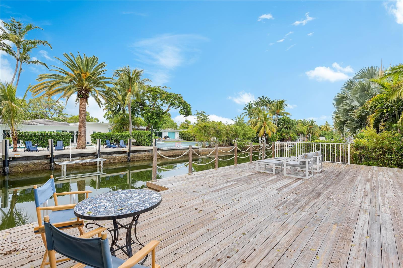 1757 Daytonia Road Miami Beach, FL 33141 - Photo 8 of 30 a view of a chairs and table on the wooden floor