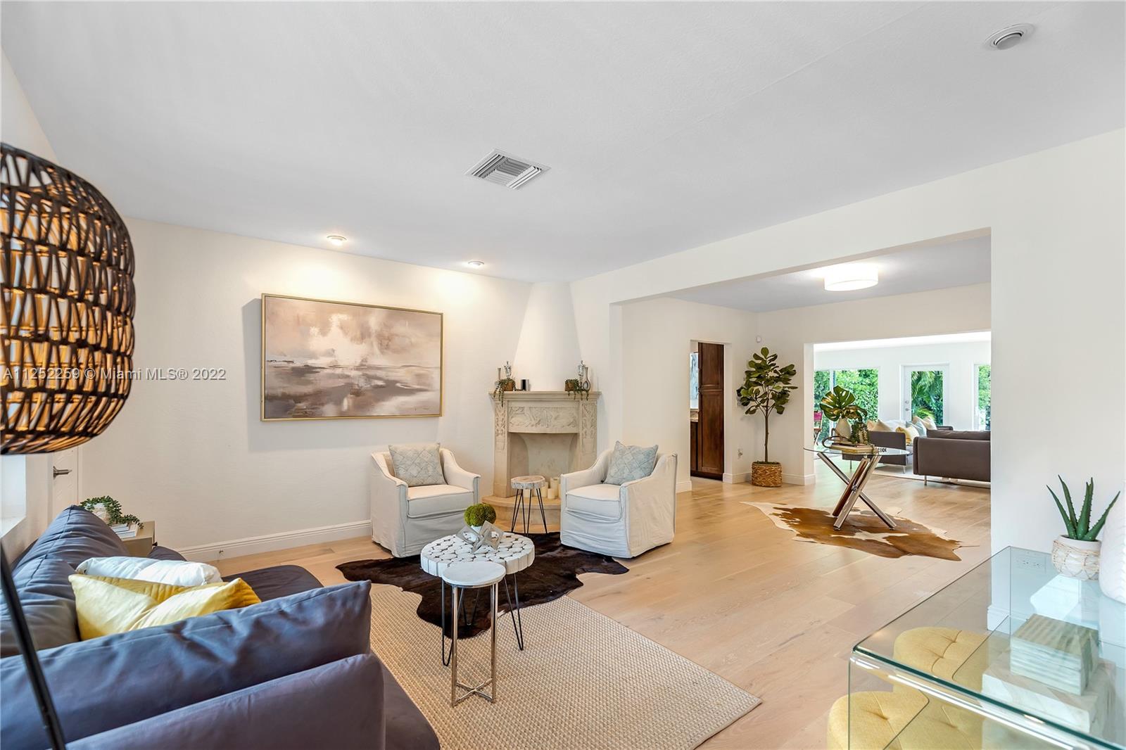 1757 Daytonia Road Miami Beach, FL 33141 - Photo 10 of 30 a living room with furniture and a table