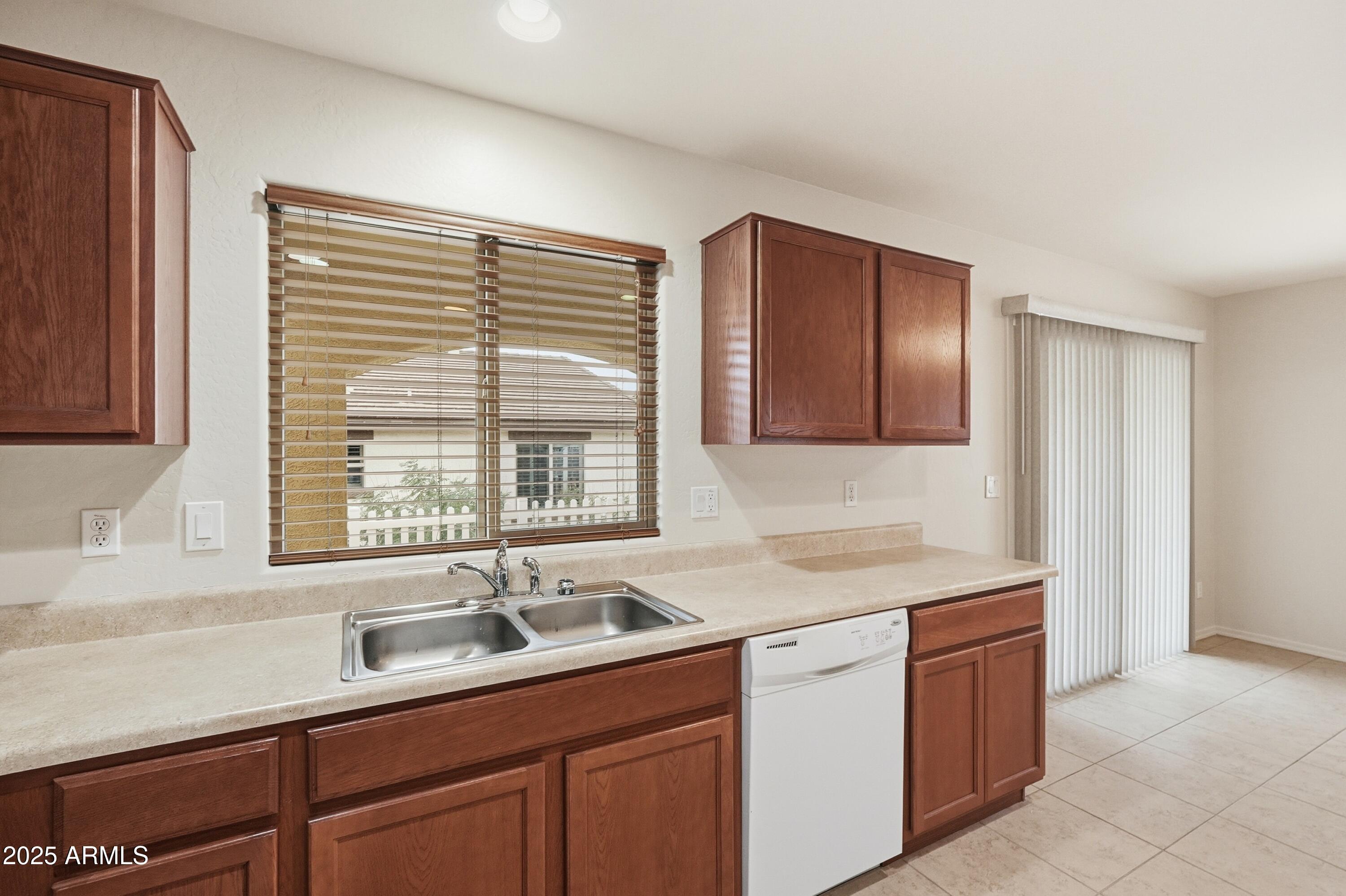 2101 South Meridian Road, Unit 210 Apache Junction, AZ 85120 - Photo 11 of 32 a kitchen with a sink and cabinets