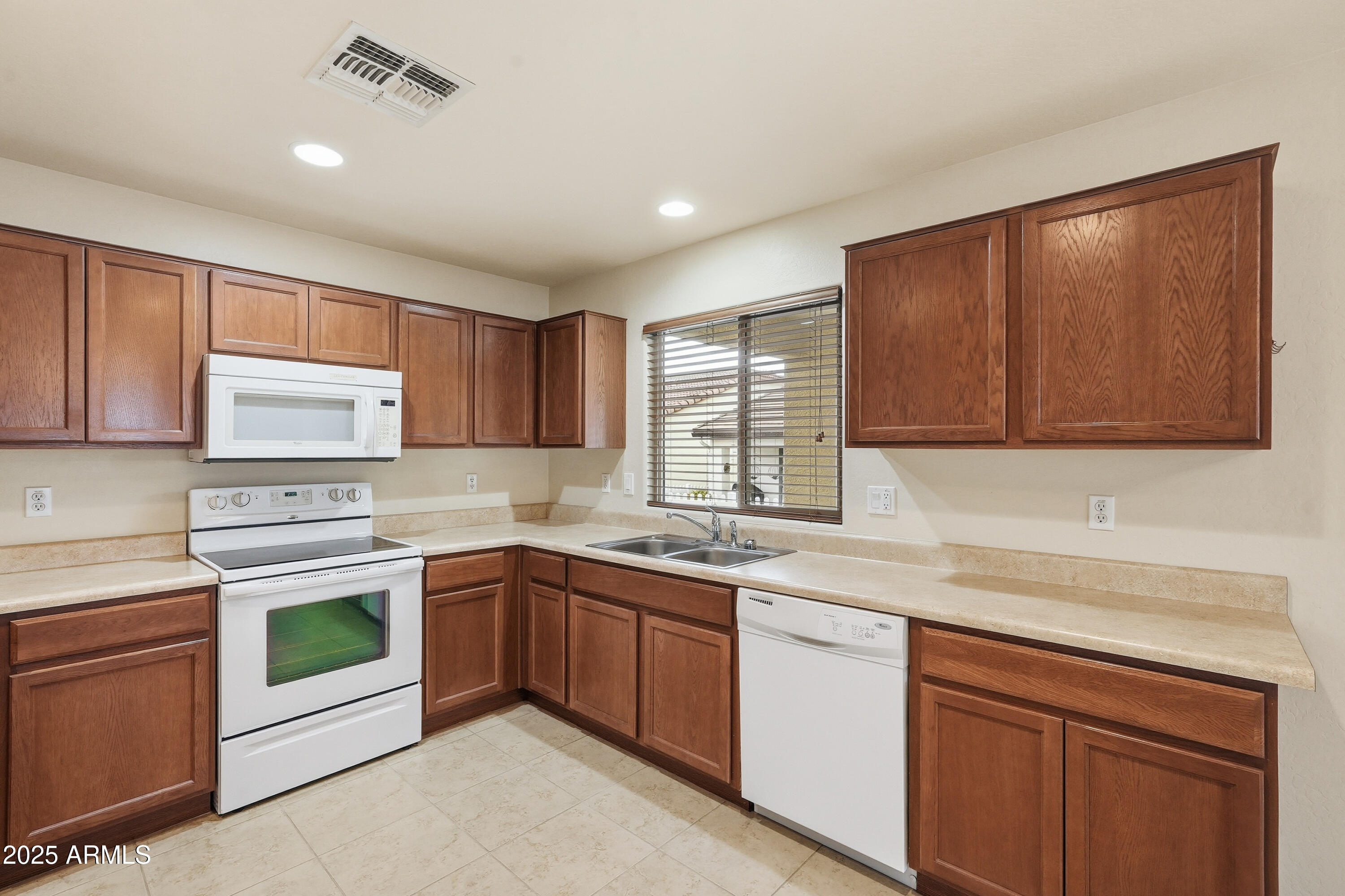 2101 South Meridian Road, Unit 210 Apache Junction, AZ 85120 - Photo 13 of 32 a kitchen with sink cabinets and window