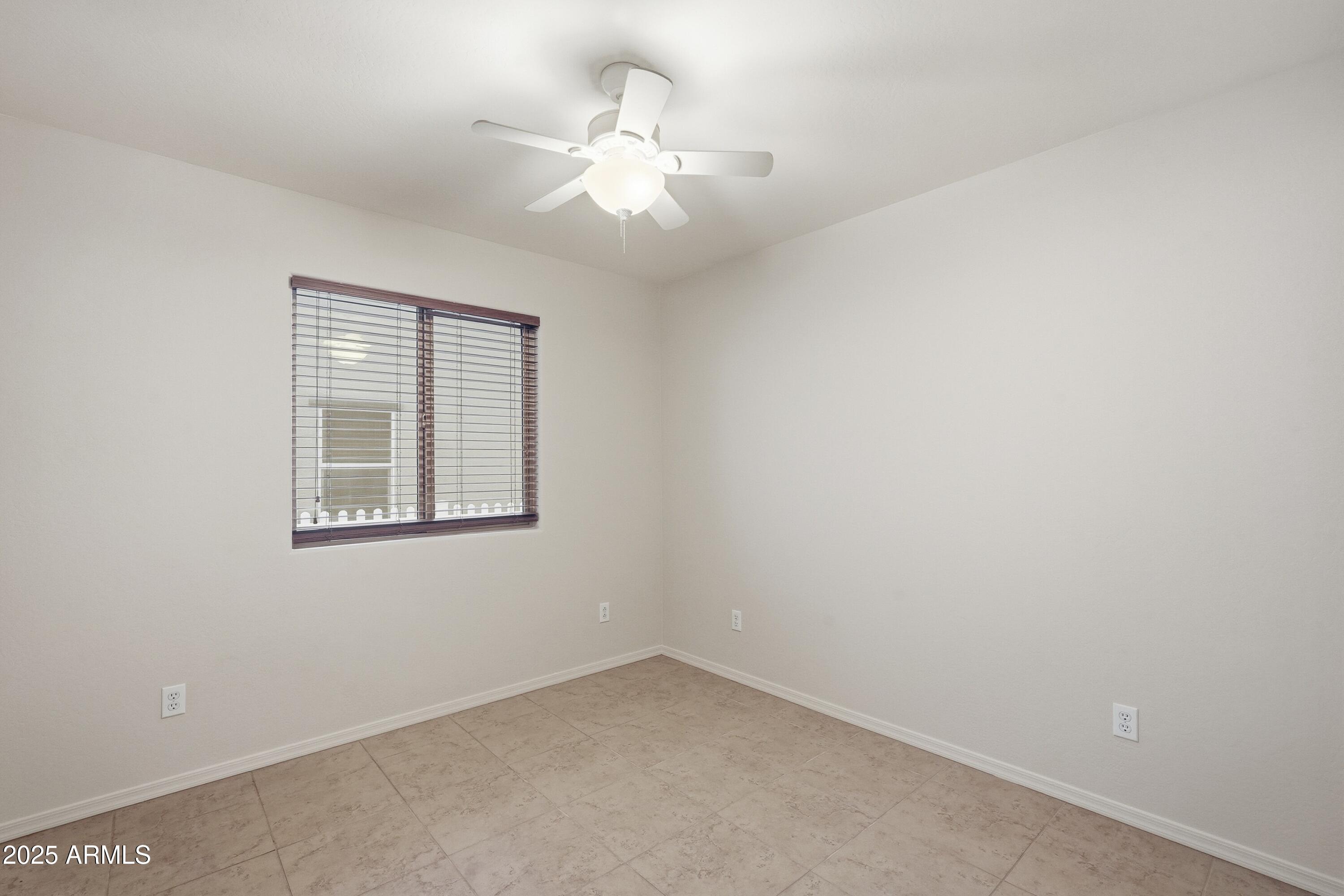2101 South Meridian Road, Unit 210 Apache Junction, AZ 85120 - Photo 14 of 32 an empty room with a window