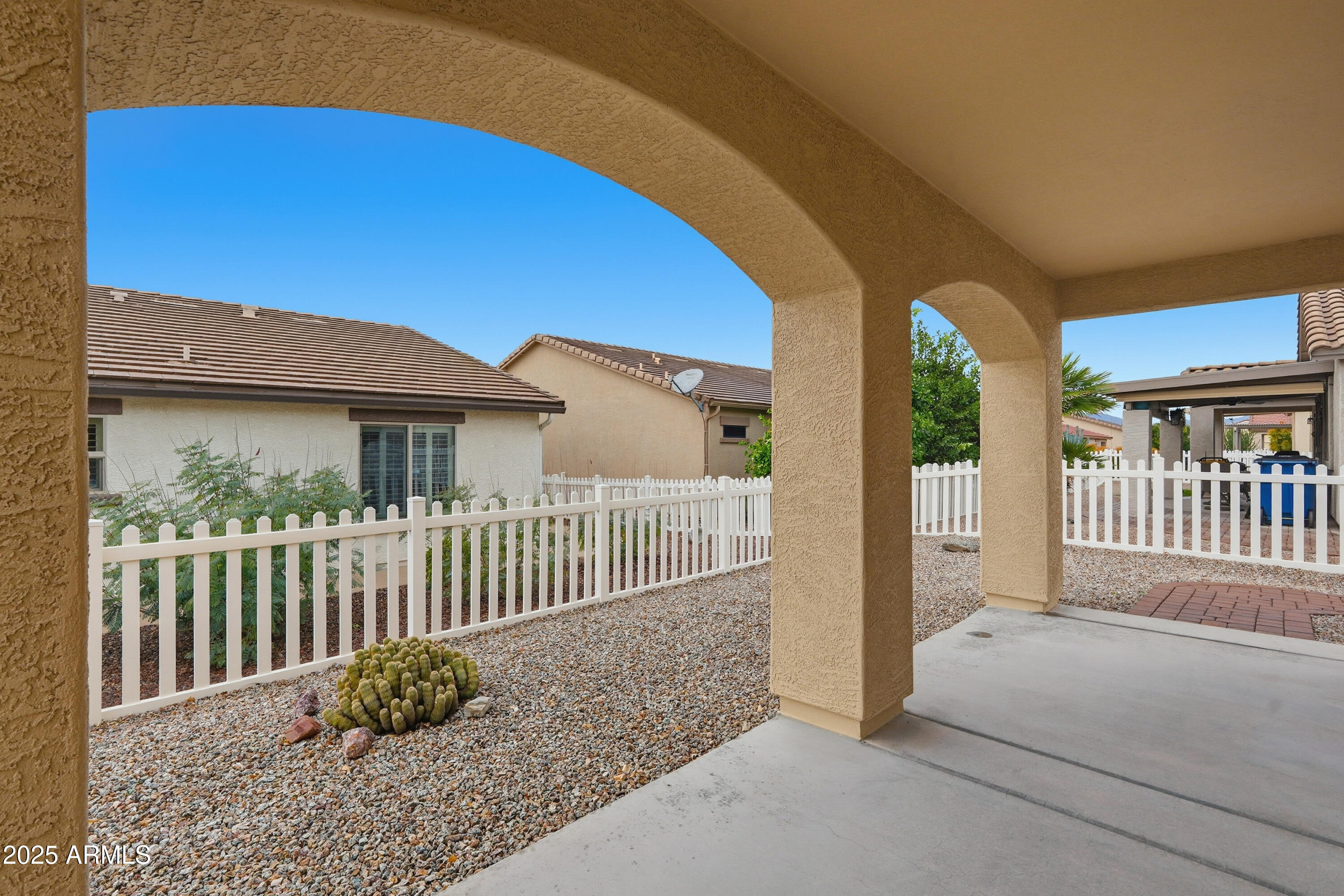 2101 South Meridian Road, Unit 210 Apache Junction, AZ 85120 - Photo 29 of 32 a view of a house with a small yard and wooden fence