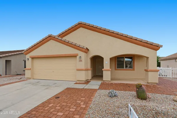 a front view of a house with a yard