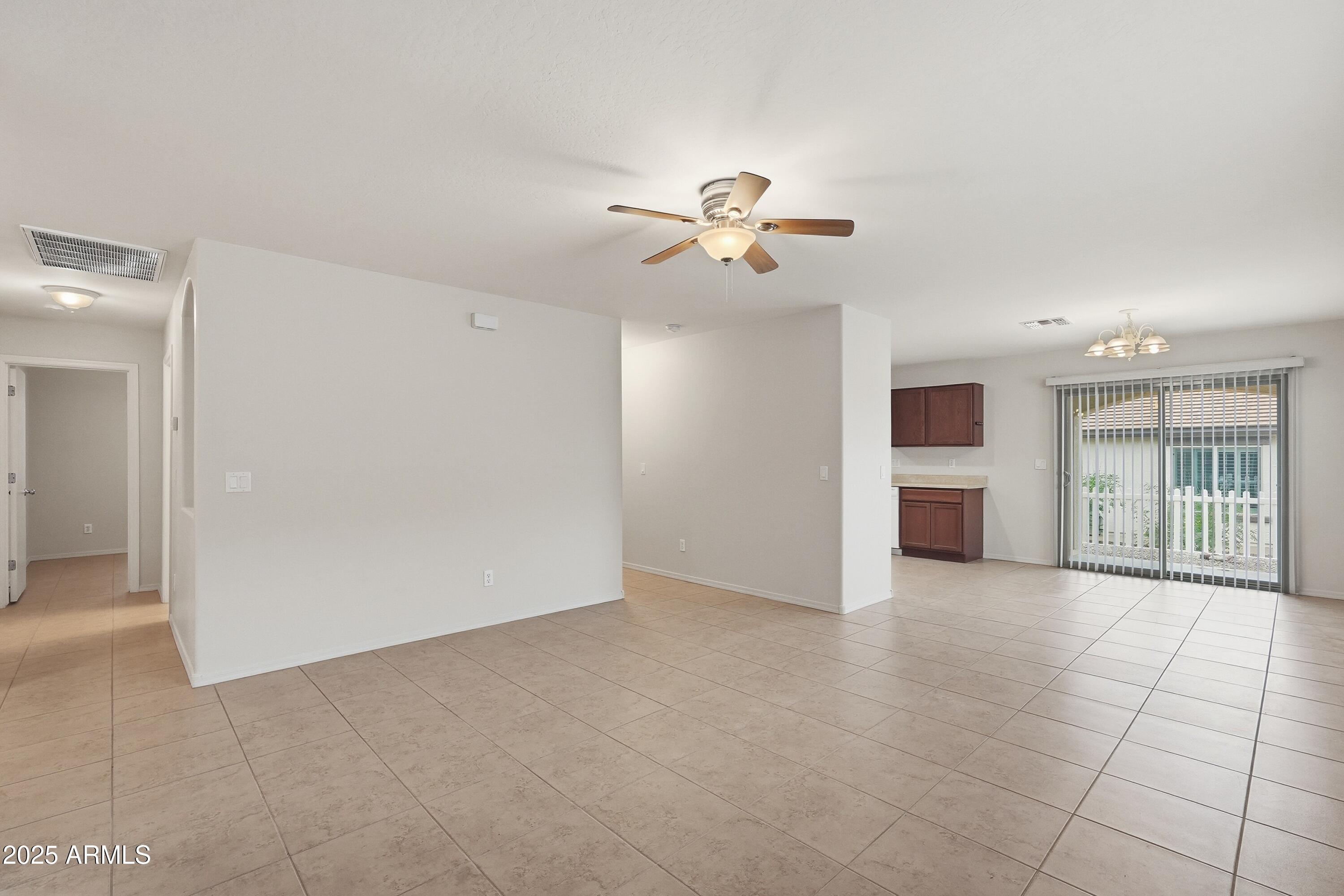 2101 South Meridian Road, Unit 210 Apache Junction, AZ 85120 - Photo 7 of 32 a view of a big room with chandelier fan and windows