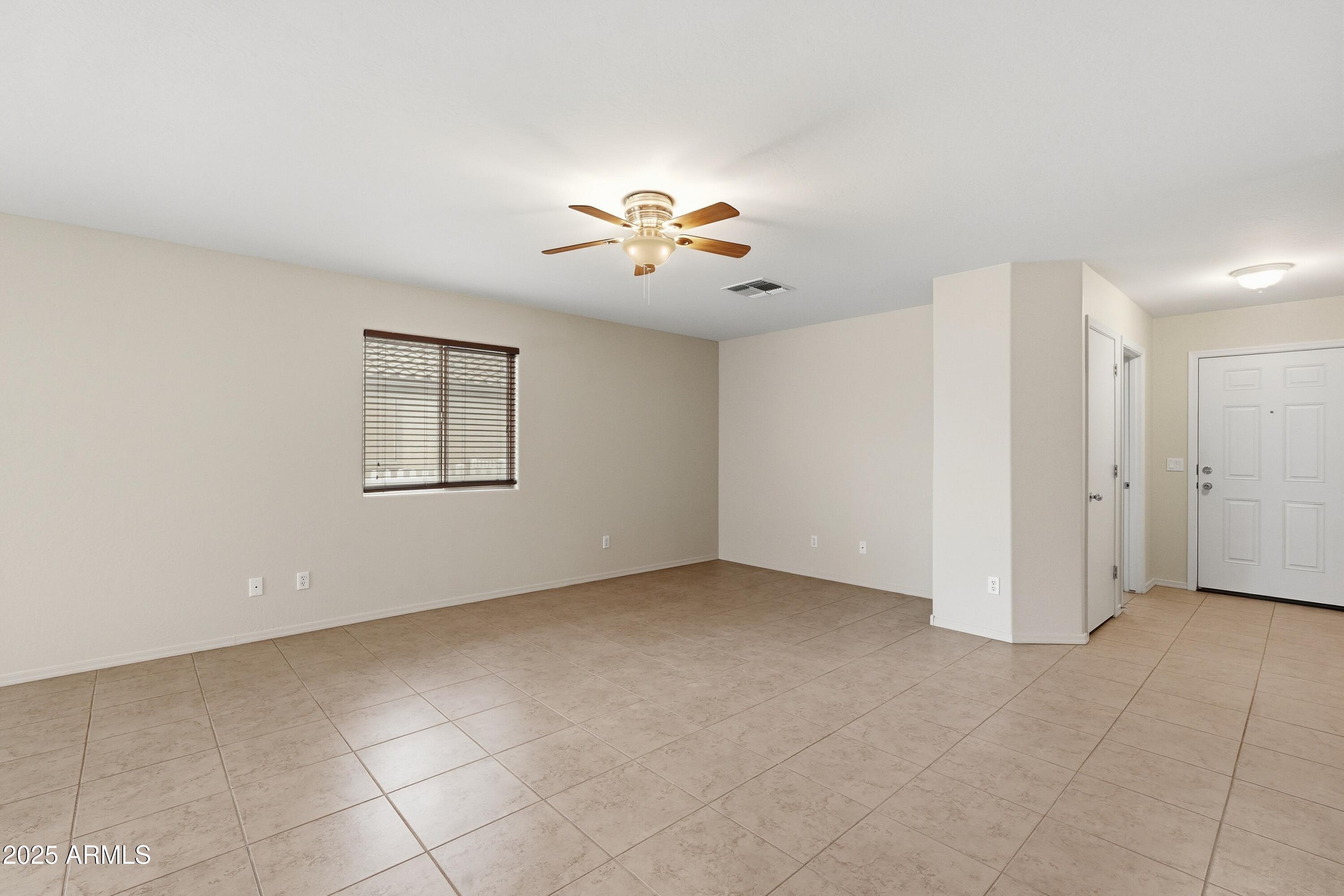 2101 South Meridian Road, Unit 210 Apache Junction, AZ 85120 - Photo 9 of 32 a view of an empty room with a window