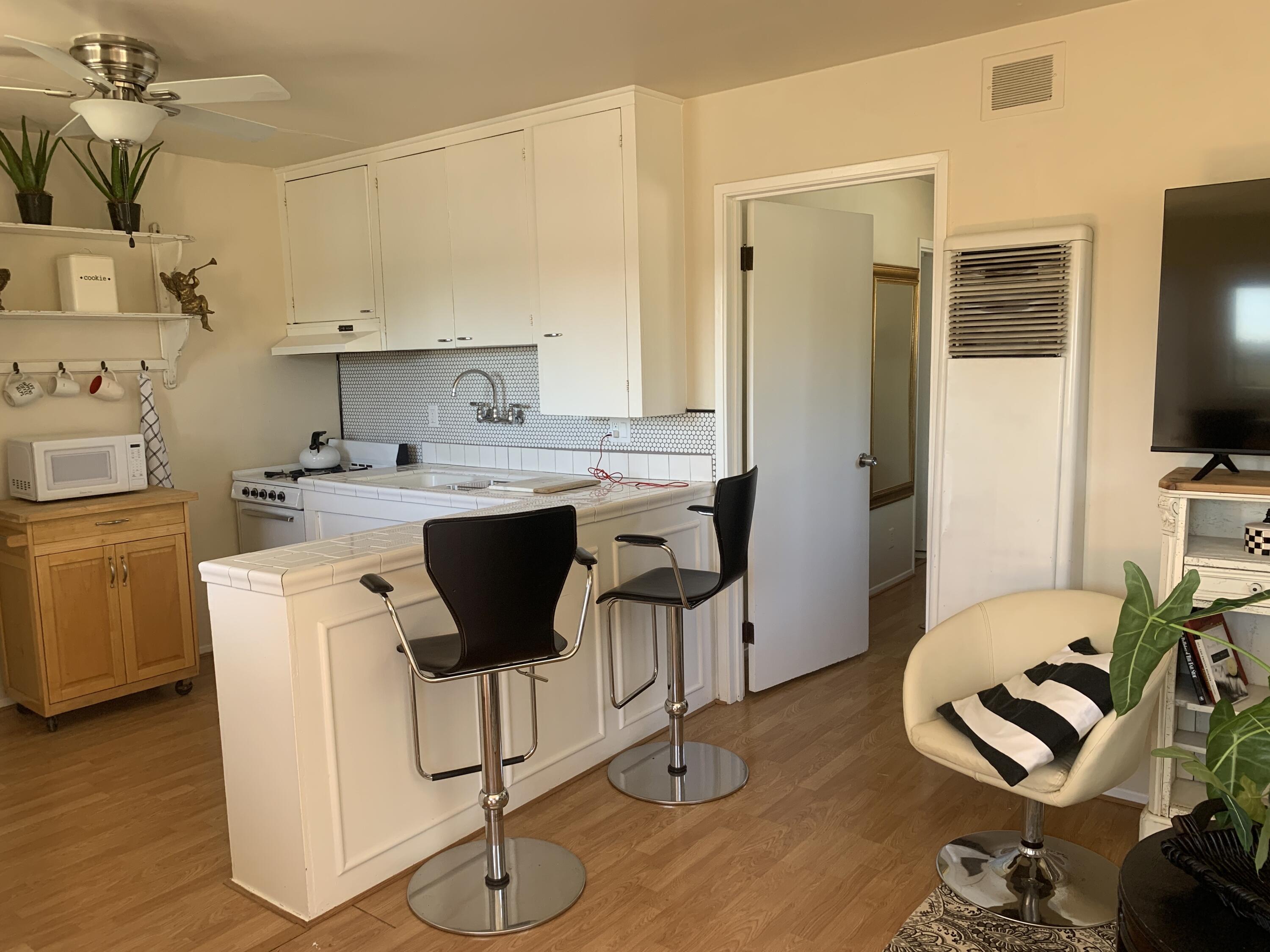 2528 De La Vina Street Santa Barbara, CA 93105 - Photo 2 of 32 a kitchen with a sink cabinets and wooden floor