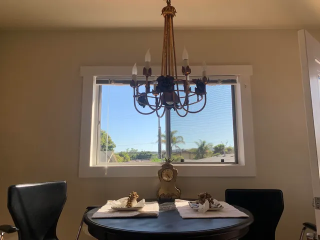 a table with a vase and flowers on it