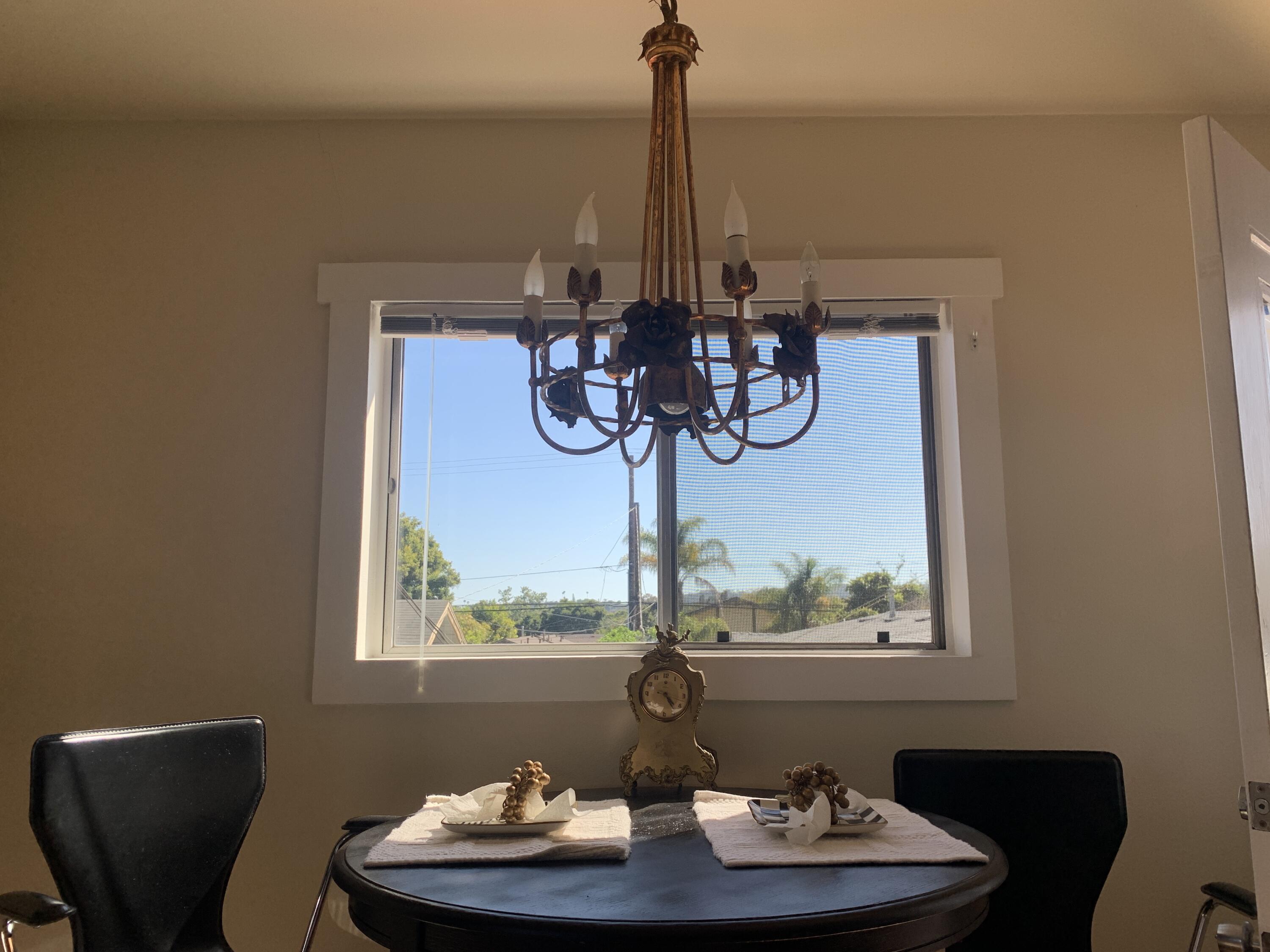 2528 De La Vina Street Santa Barbara, CA 93105 - Photo 26 of 32 a table with a vase and flowers on it