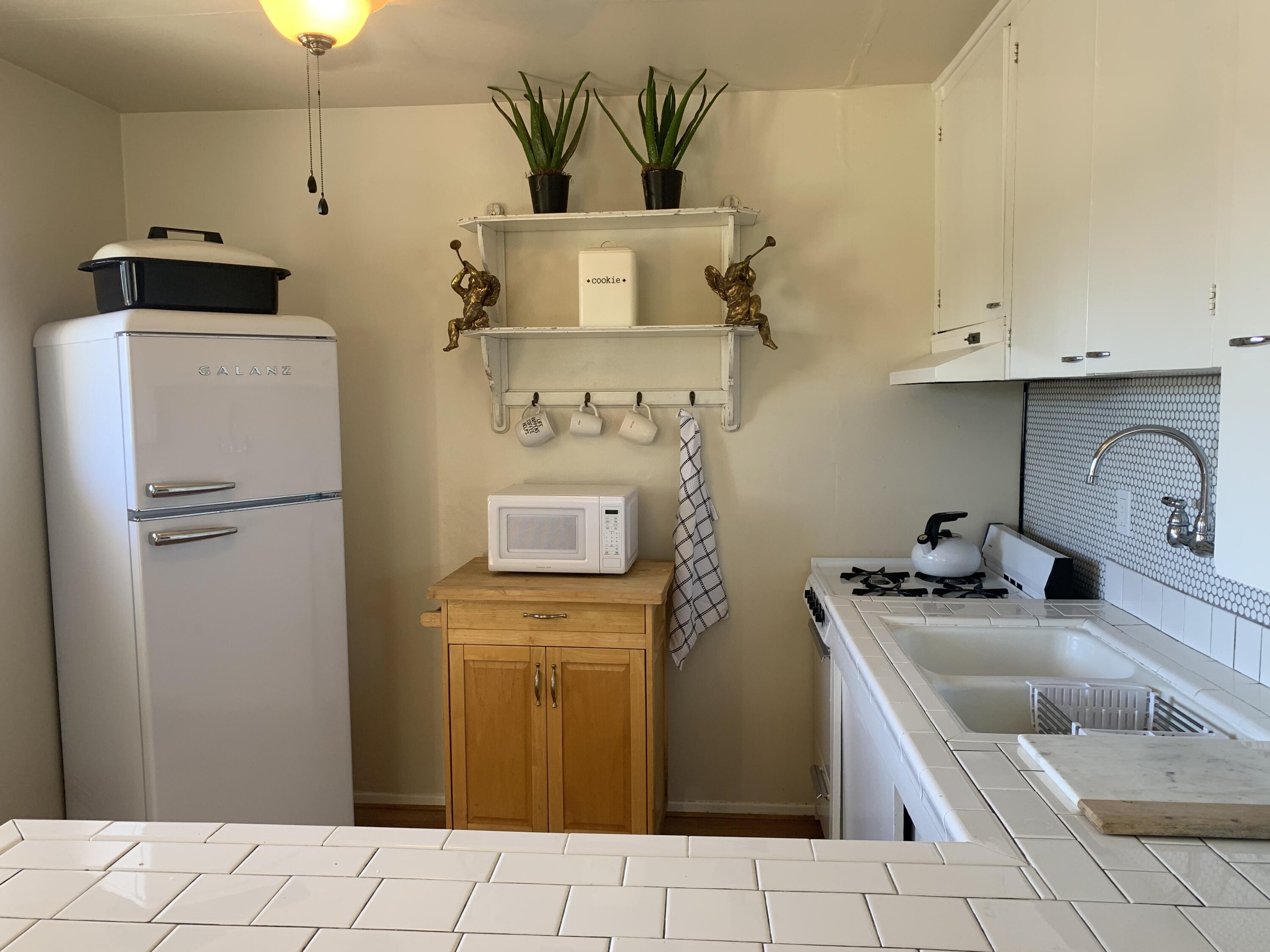 2528 De La Vina Street Santa Barbara, CA 93105 - Photo 32 of 32 a kitchen with stainless steel appliances a sink a refrigerator and a cabinets