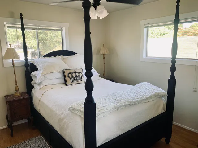 a bedroom with a bed and window