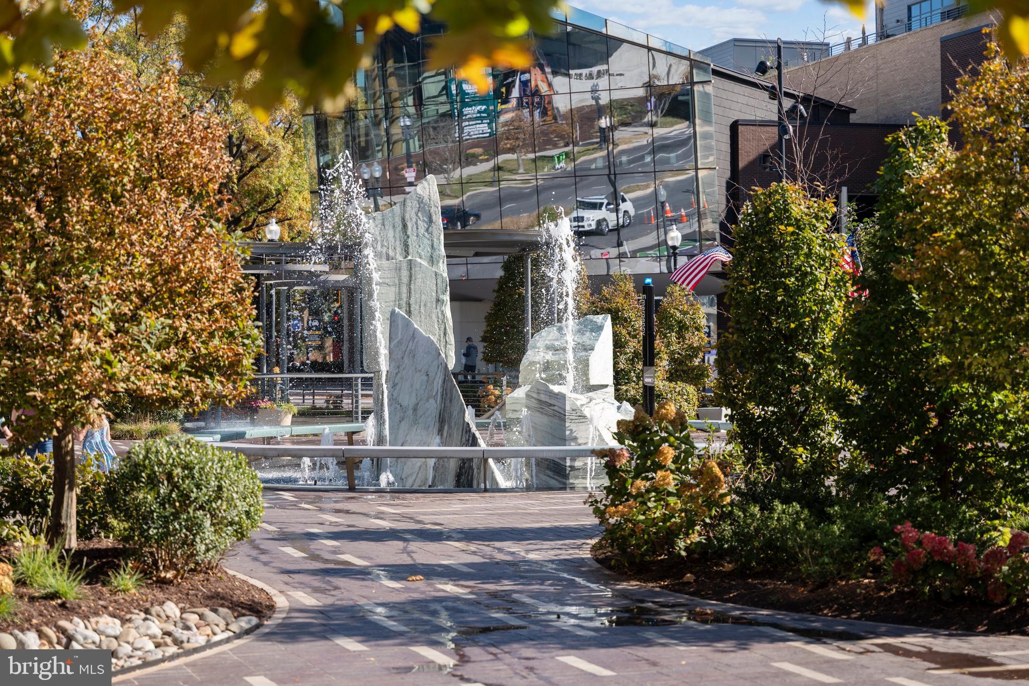 45 Sutton Square Southwest, Unit 509 Washington, DC 20024 - Photo 22 of 25 a front view of a house with a yard