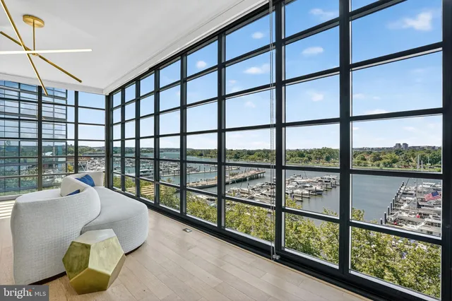 a view of a living room and a balcony