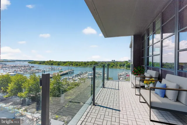 a balcony with furniture and city view