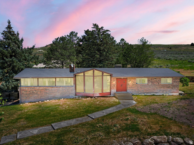 15680 North Beaver Dam Road Collinston, UT 84306 - Photo 2 of 49 Brick exterior with a prominent sunroom