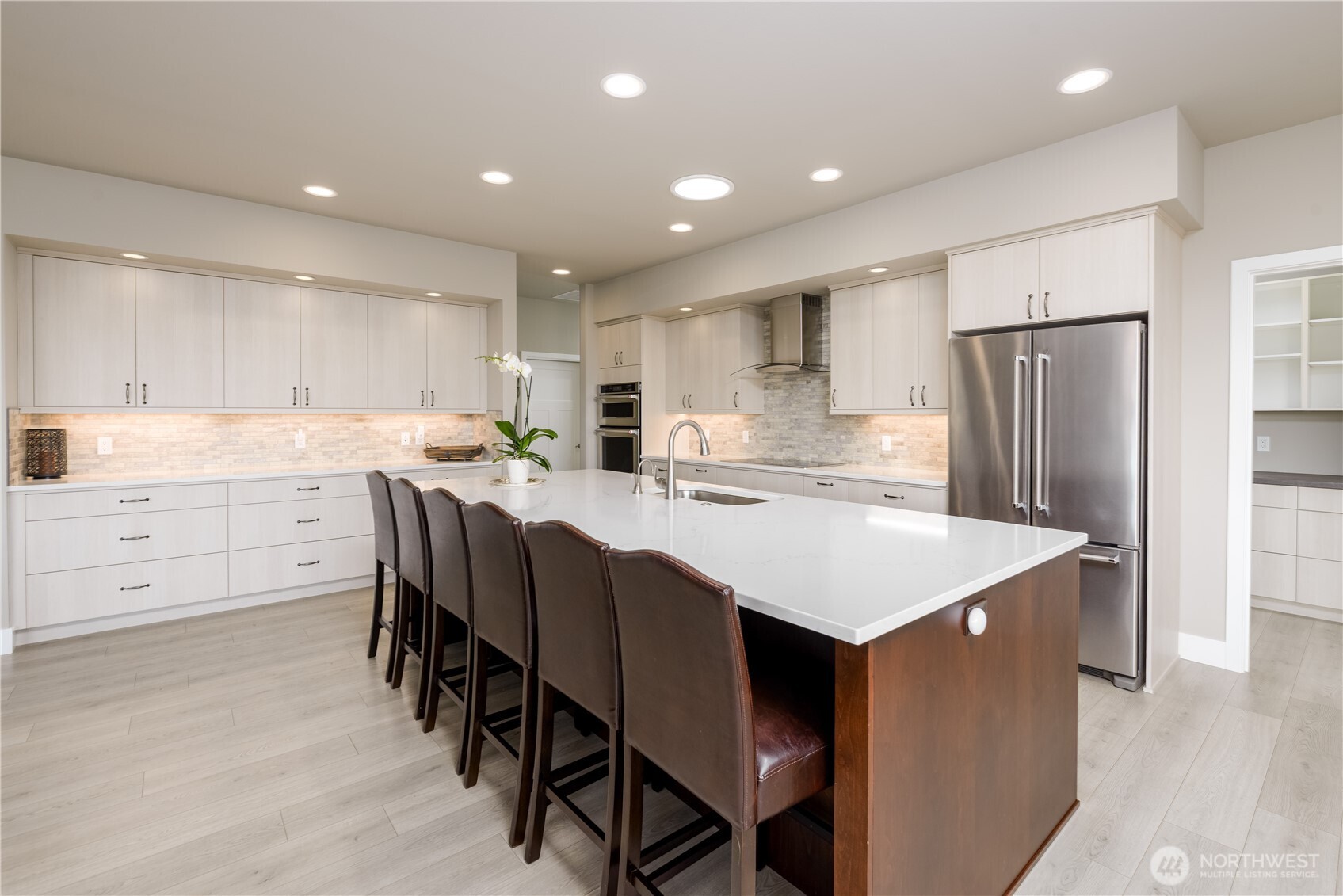 621 Jones Farm Road Sequim, WA 98382 - Photo 11 of 40 a kitchen with refrigerator cabinets and a center island