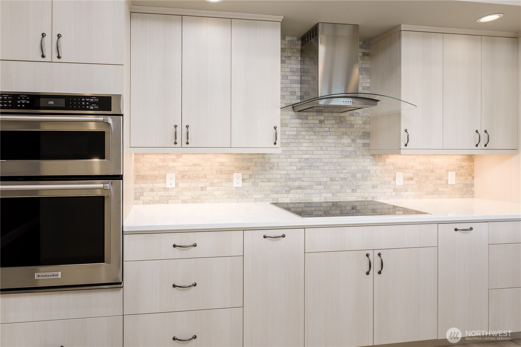 621 Jones Farm Road Sequim, WA 98382 - Photo 13 of 40 a kitchen with granite countertop white cabinets and stainless steel appliances