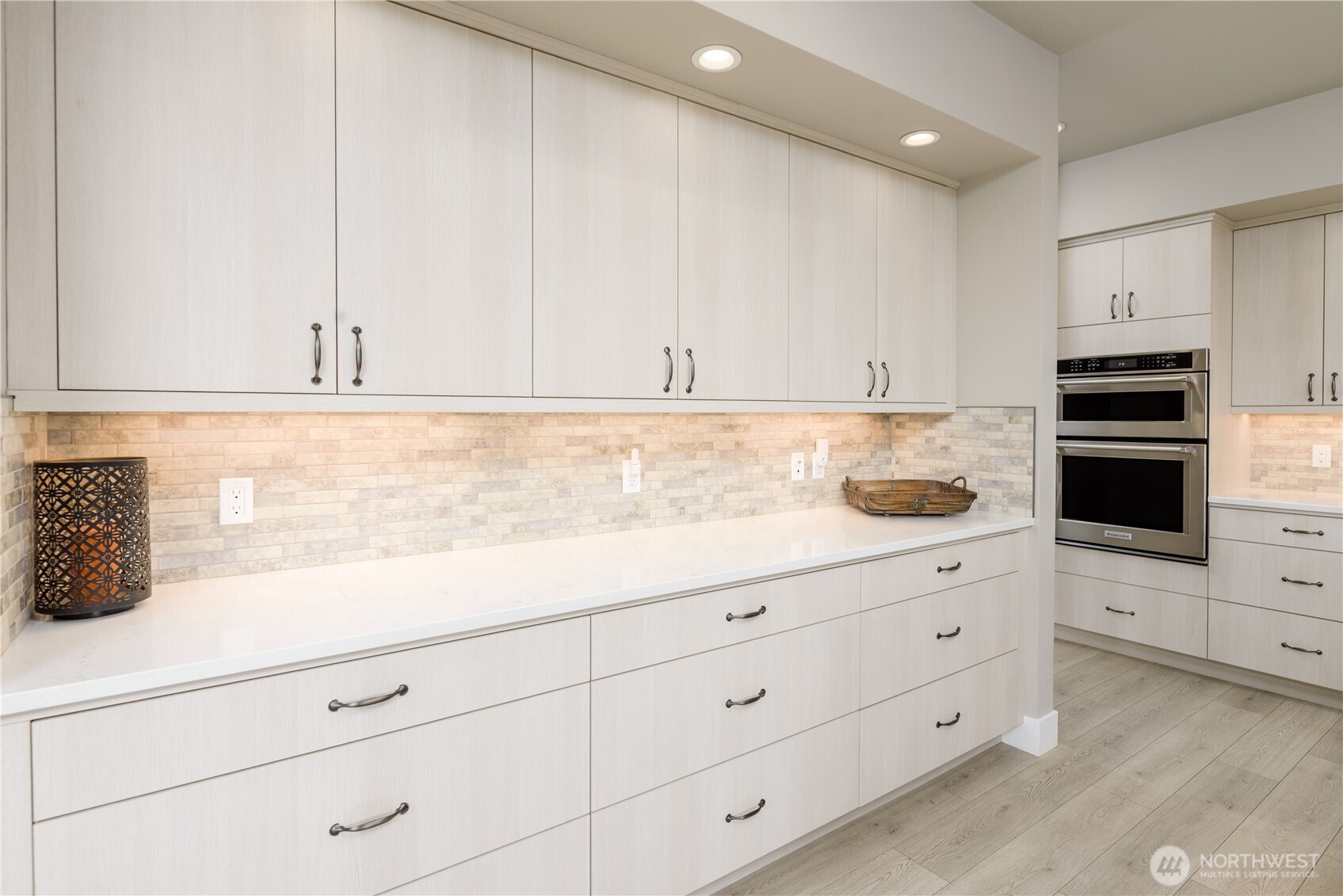 621 Jones Farm Road Sequim, WA 98382 - Photo 16 of 40 a kitchen with granite countertop white cabinets and stainless steel appliances