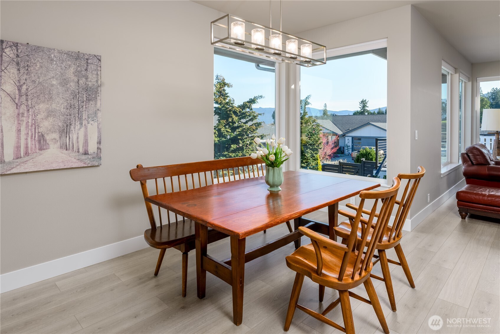 621 Jones Farm Road Sequim, WA 98382 - Photo 19 of 40 a view of a dining room with furniture window and wooden floor