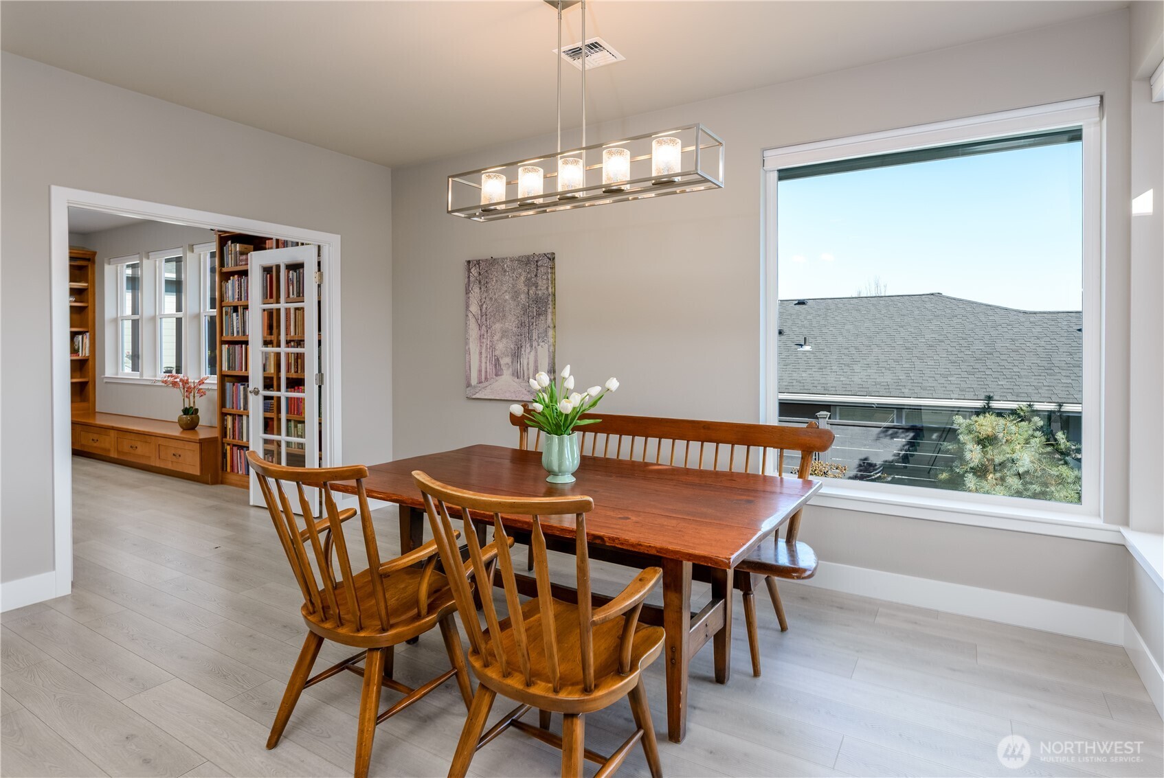 621 Jones Farm Road Sequim, WA 98382 - Photo 20 of 40 a dining room with furniture a chandelier and wooden floor