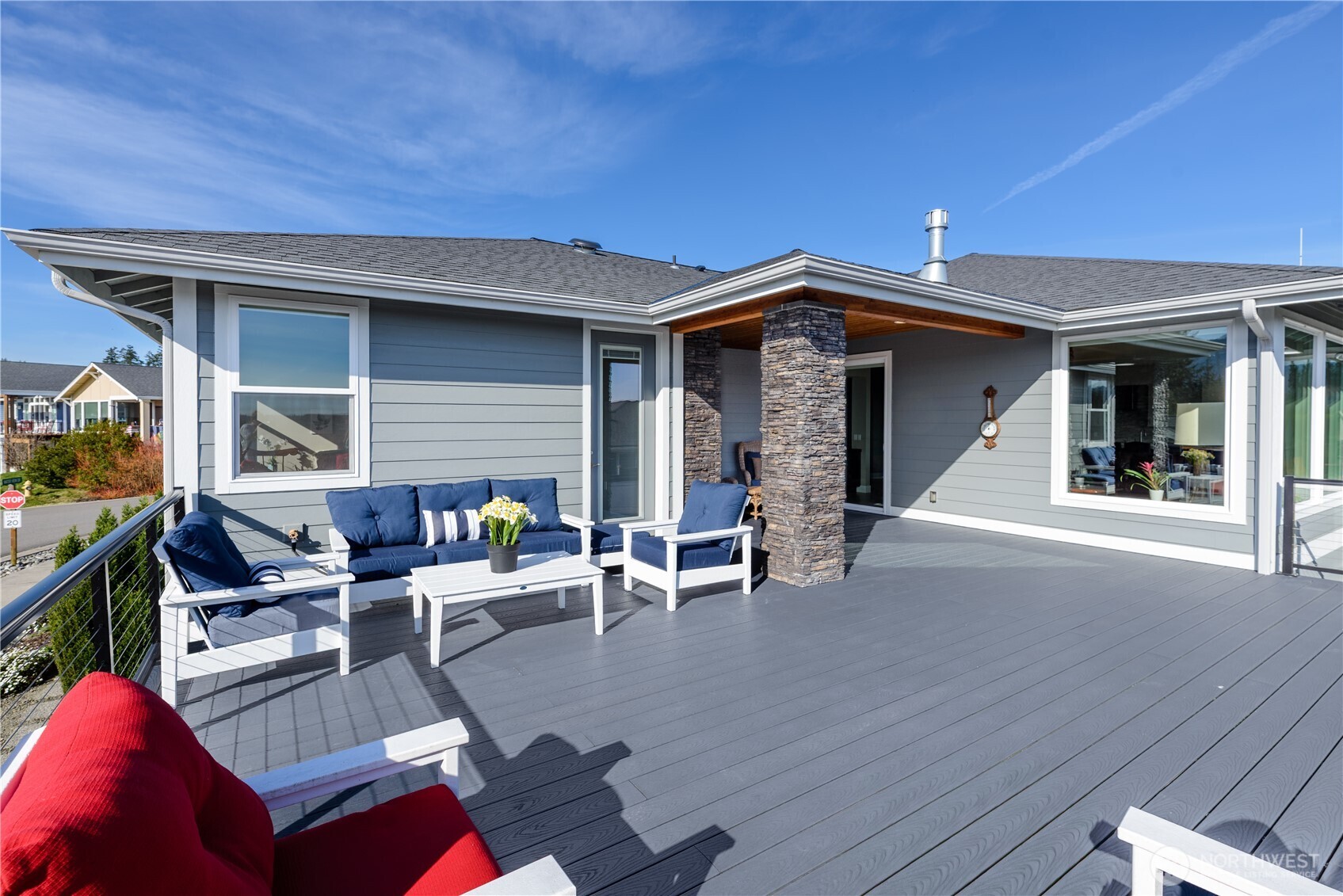 621 Jones Farm Road Sequim, WA 98382 - Photo 36 of 40 a view of a patio with couches and table and chairs with wooden floor and fence