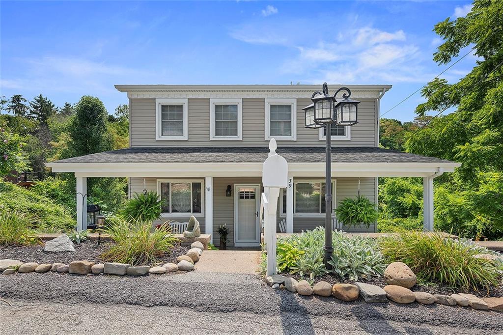 front view of a house with a yard