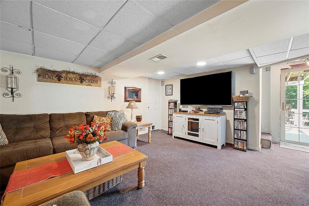 39 Diebold Road McKees Rocks, PA 15136 - Photo 21 of 25 a living room with furniture and a flat screen tv