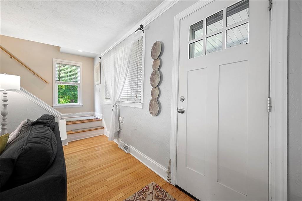 39 Diebold Road McKees Rocks, PA 15136 - Photo 3 of 25 a view of a hallway with windows and stairs