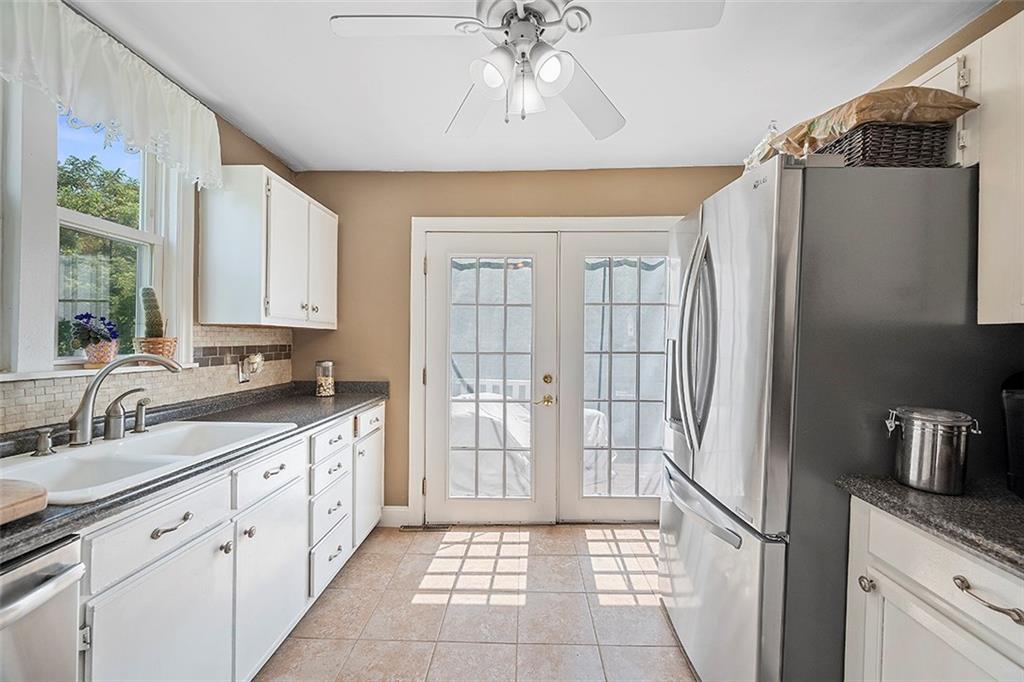 39 Diebold Road McKees Rocks, PA 15136 - Photo 7 of 25 a kitchen with stainless steel appliances granite countertop a refrigerator and a sink