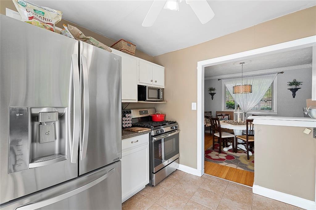 39 Diebold Road McKees Rocks, PA 15136 - Photo 8 of 25 a kitchen with stainless steel appliances a refrigerator and a stove