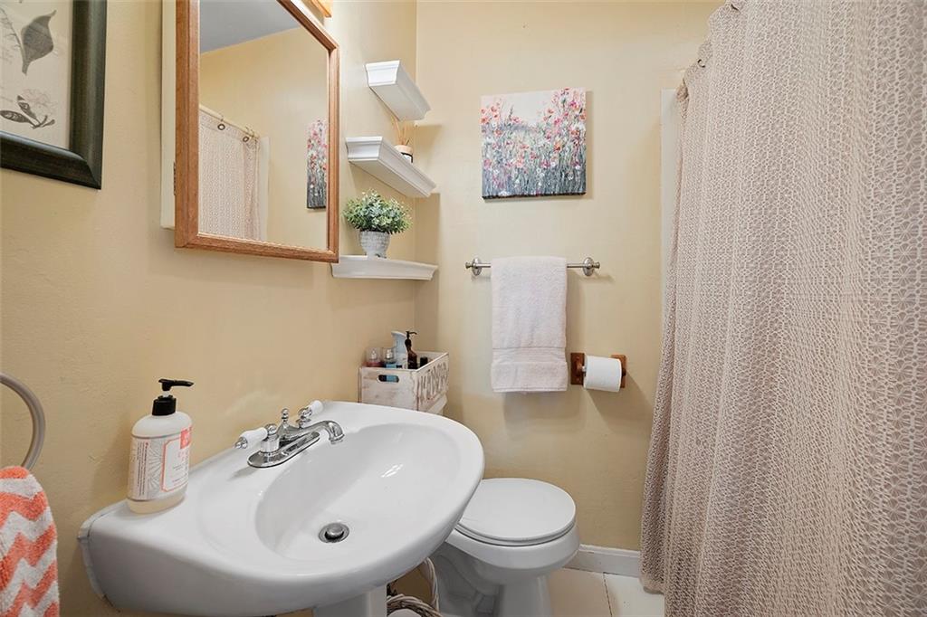 39 Diebold Road McKees Rocks, PA 15136 - Photo 9 of 25 a bathroom with a sink toilet and mirror