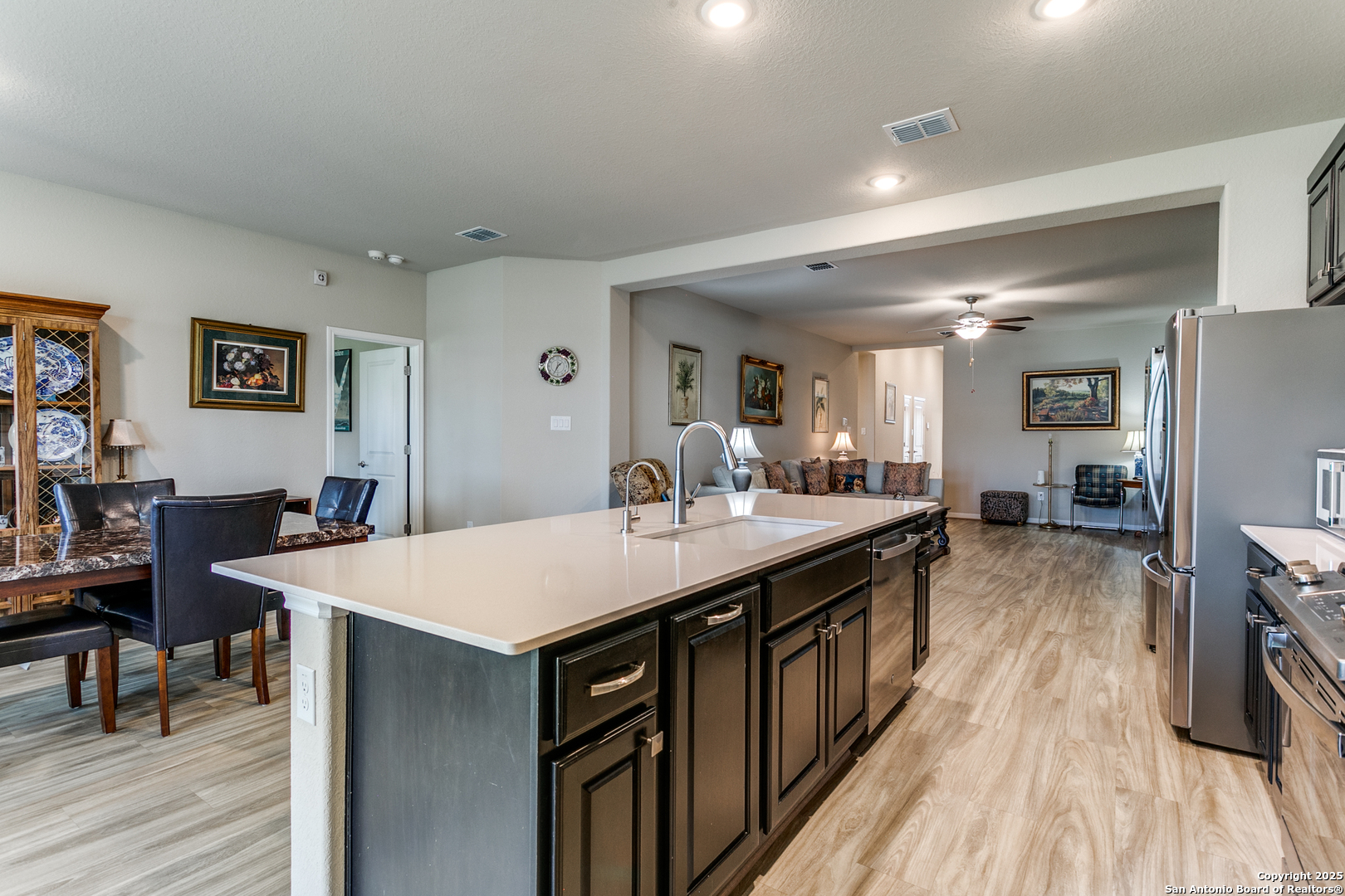 8359 Sunrise Schertz, TX 78154 - Photo 13 of 21 a large kitchen with kitchen island a sink table and chairs