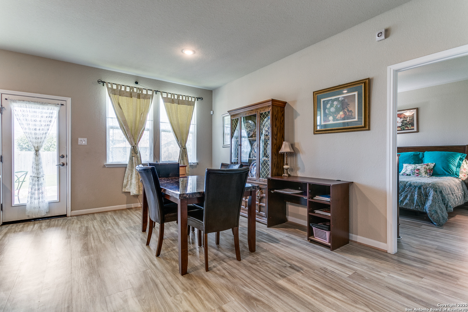 8359 Sunrise Schertz, TX 78154 - Photo 8 of 21 a view of a dining room with furniture and wooden floor