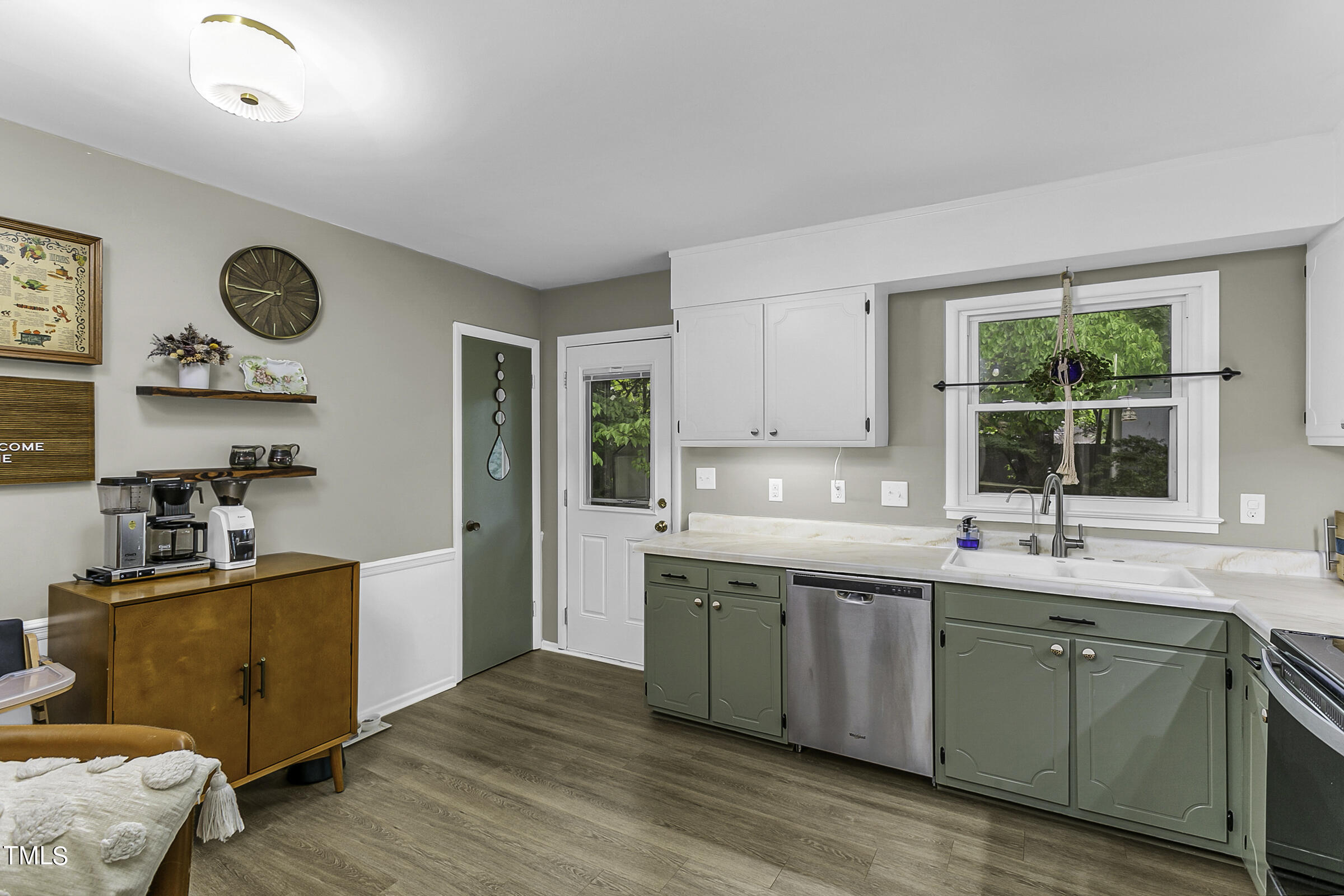 4120 Toroella Street Durham, NC 27704 - Photo 11 of 21 a kitchen with stainless steel appliances granite countertop a sink and cabinets