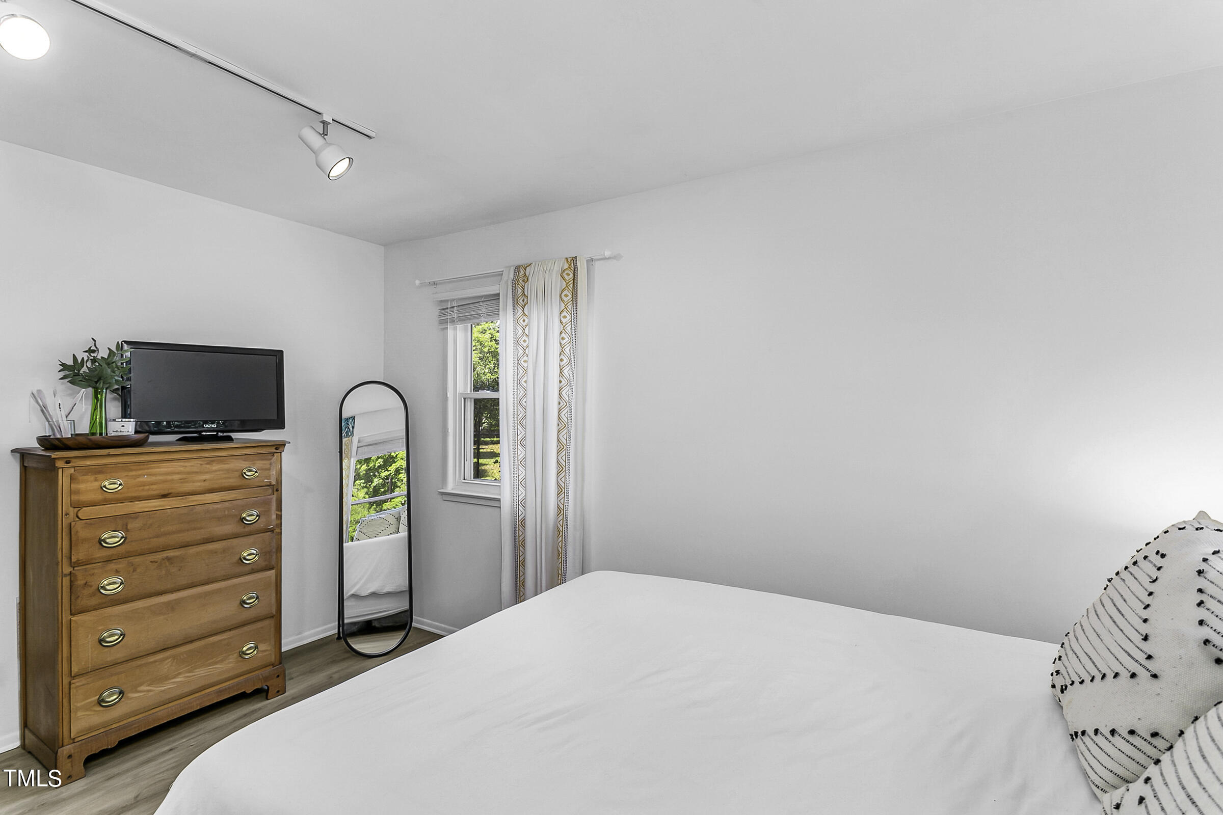 4120 Toroella Street Durham, NC 27704 - Photo 16 of 21 a bedroom with a bed and furniture