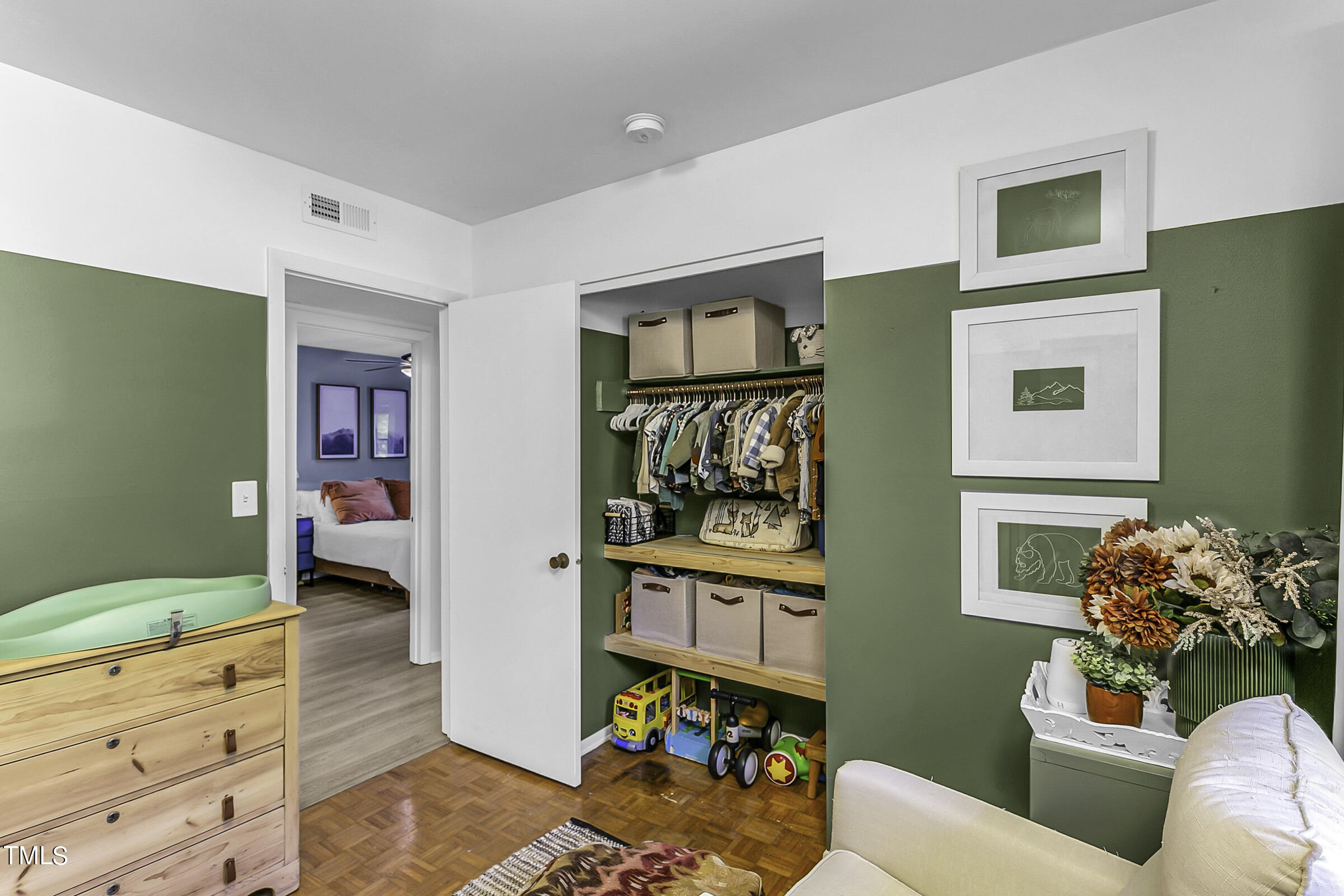 4120 Toroella Street Durham, NC 27704 - Photo 19 of 21 a living room with furniture and baby crib