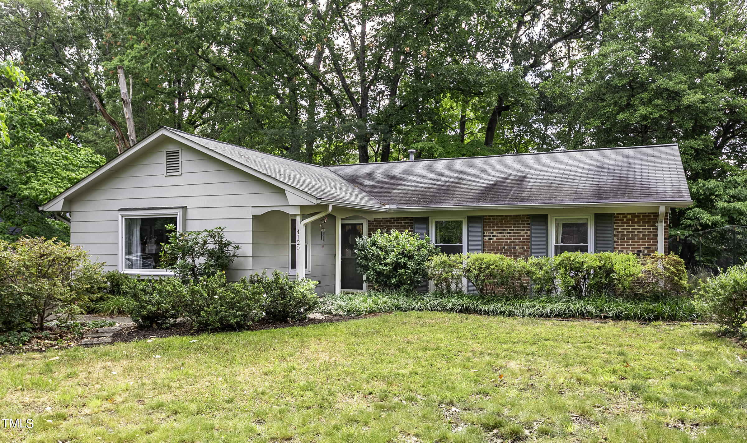 4120 Toroella Street Durham, NC 27704 - Photo 3 of 21 a view of an house with backyard space and garden