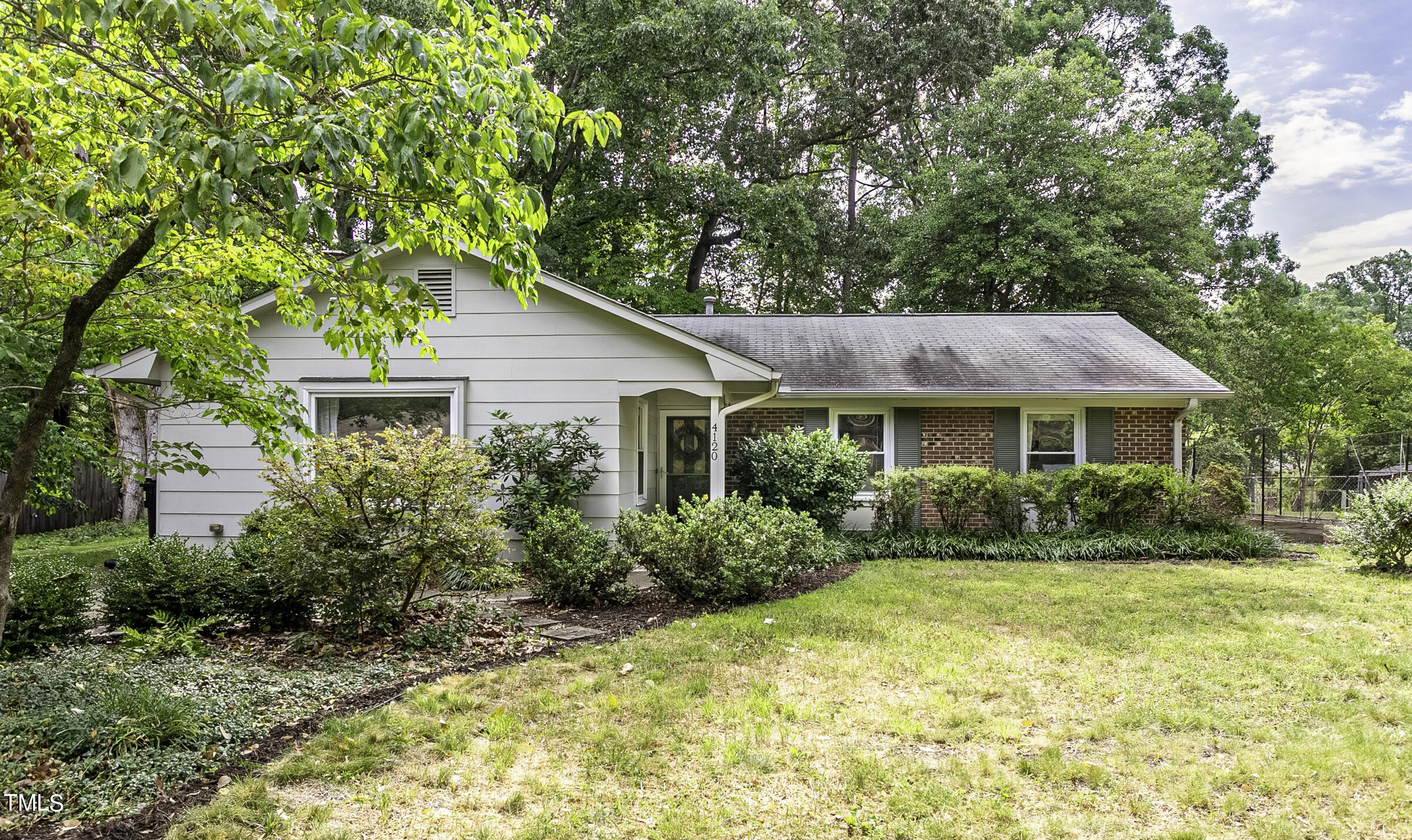 4120 Toroella Street Durham, NC 27704 - Photo 4 of 21 a front view of a house with a yard
