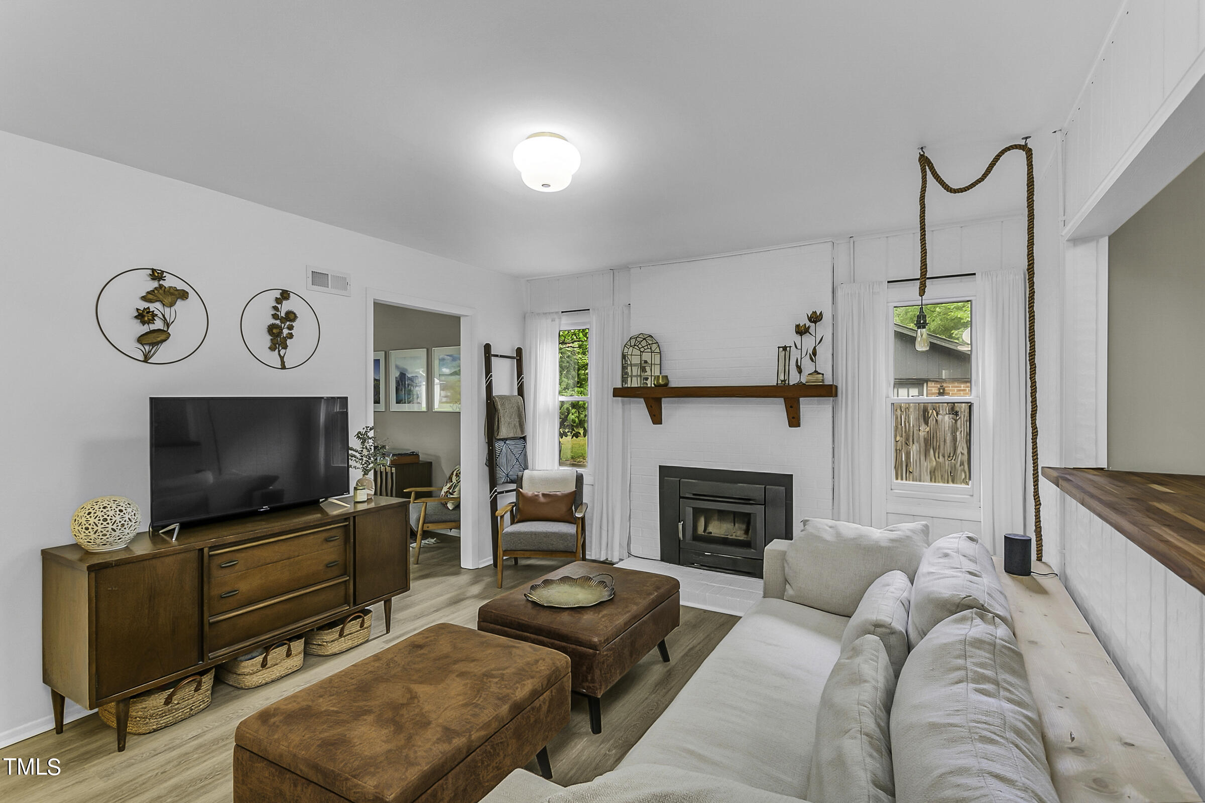 4120 Toroella Street Durham, NC 27704 - Photo 7 of 21 a living room with furniture and a flat screen tv