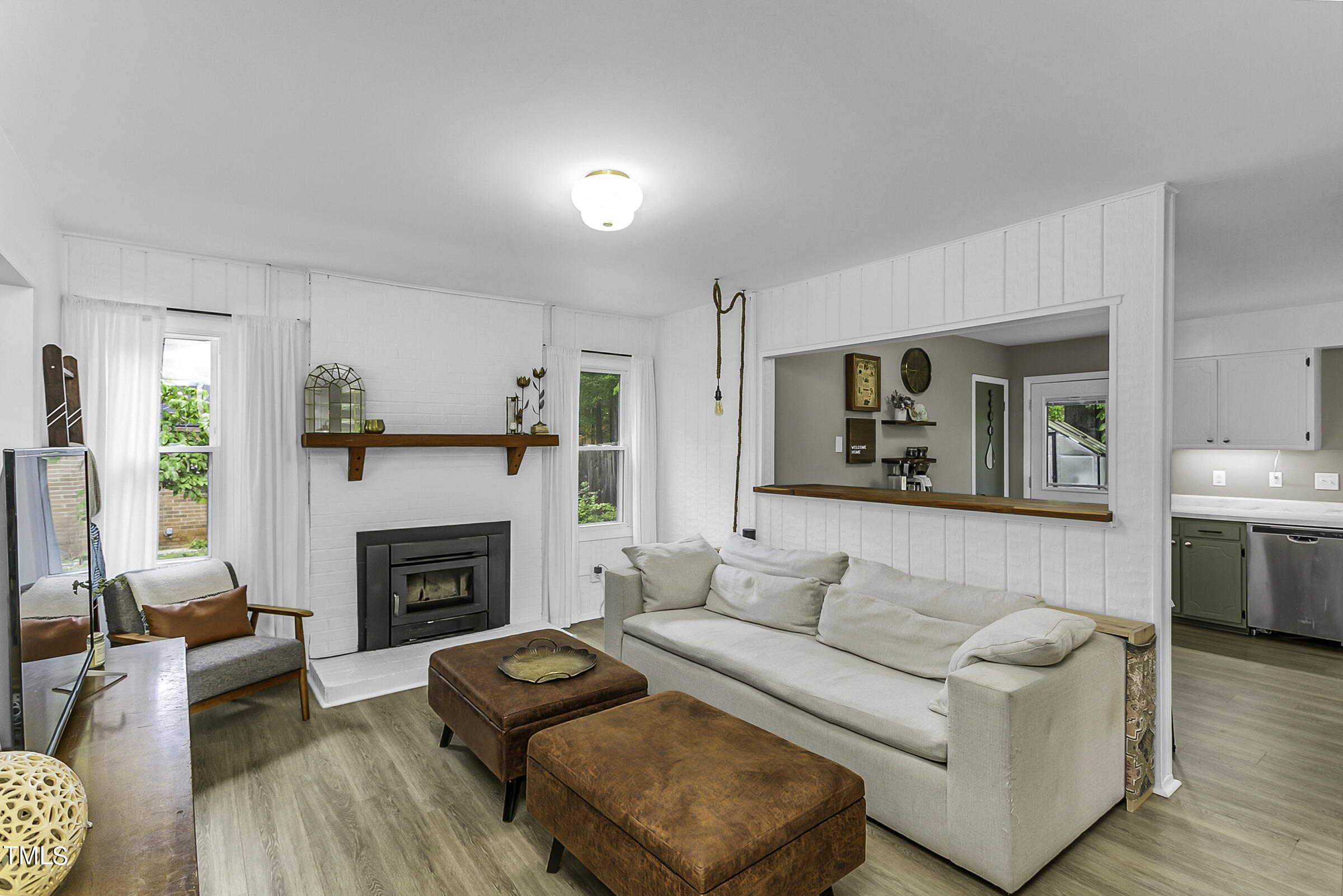 4120 Toroella Street Durham, NC 27704 - Photo 8 of 21 a living room with furniture and a fireplace