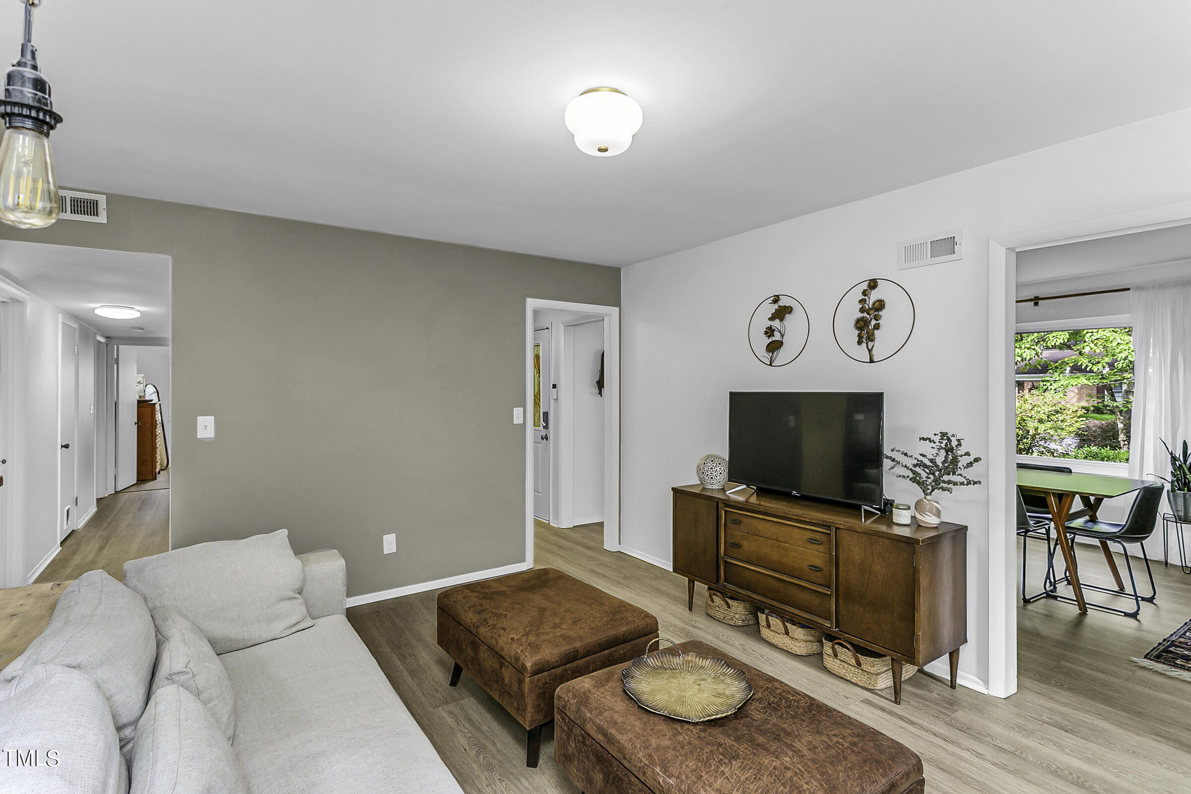 4120 Toroella Street Durham, NC 27704 - Photo 9 of 21 a living room with furniture and a flat screen tv