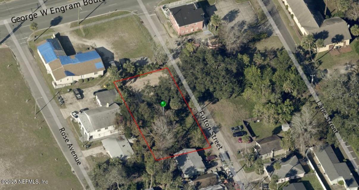 358 Fulton Street Daytona Beach, FL 32114 - Photo 1 of 5 an aerial view of a house with a yard