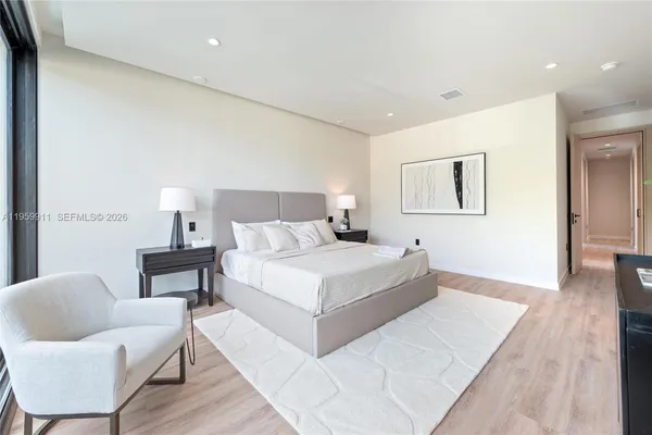 a bedroom with a bed and a couch