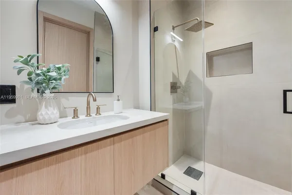 a bathroom with a sink and a mirror