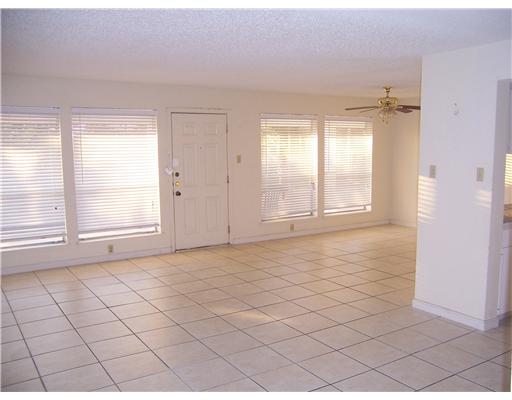 14741 Compass Street, Unit 12 Corpus Christi, TX 78418 - Photo 2 of 6 a view of an empty room and window