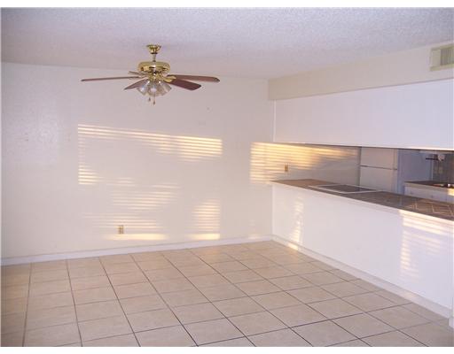 14741 Compass Street, Unit 12 Corpus Christi, TX 78418 - Photo 4 of 6 a view of a room with window and a ceiling fan