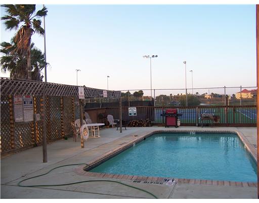 14741 Compass Street, Unit 12 Corpus Christi, TX 78418 - Photo 6 of 6 a view of swimming pool with outdoor seating
